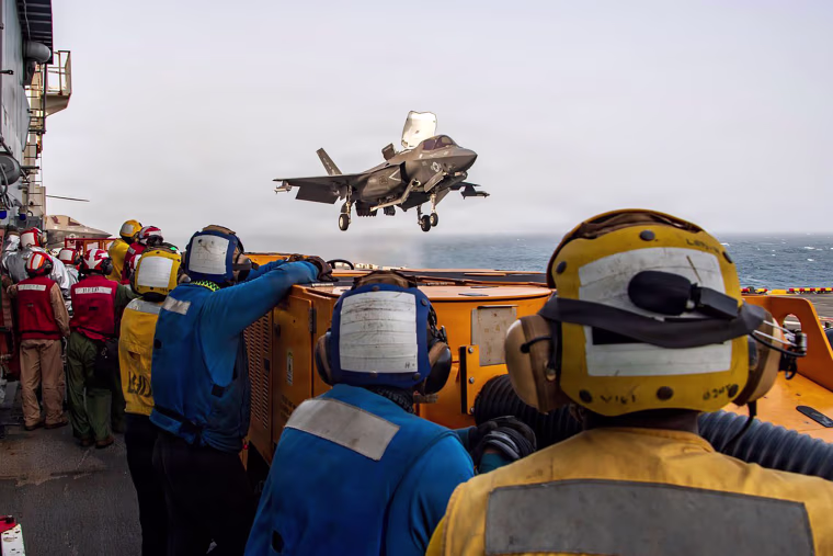 U.S. service members support flight operations from the Arabian Sea in an official photo shared July 20.