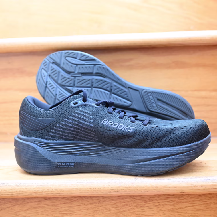 A close-up of the Brooks Ghost Max 3 resting against a wooden stair.