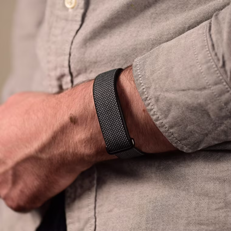 A close-up of the Google Fitbit Air on the wrist of the writer.