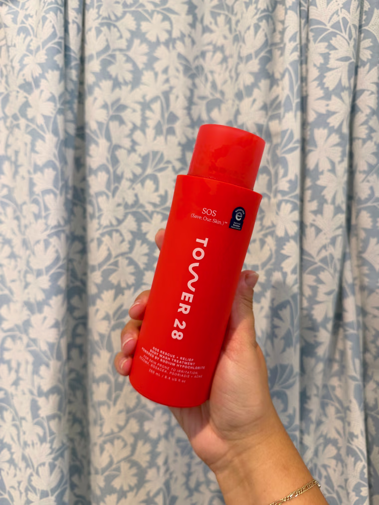 Person holding SOS Rescue + Relief Body Wash Treatment