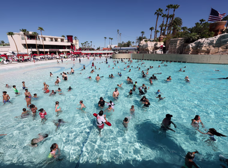 Image: Guests cool off in the wave pool to escape a heat dome.