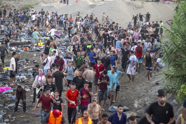 Hundreds of migrants reach Spain's Ceuta after swimming from Morocco