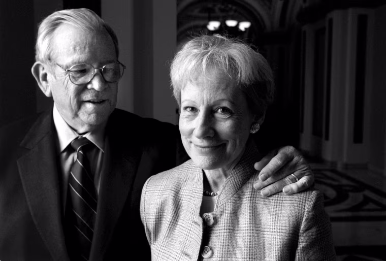 A black and white photo of Howard Baker with his arm around Nancy Kassebaum's shoulder.