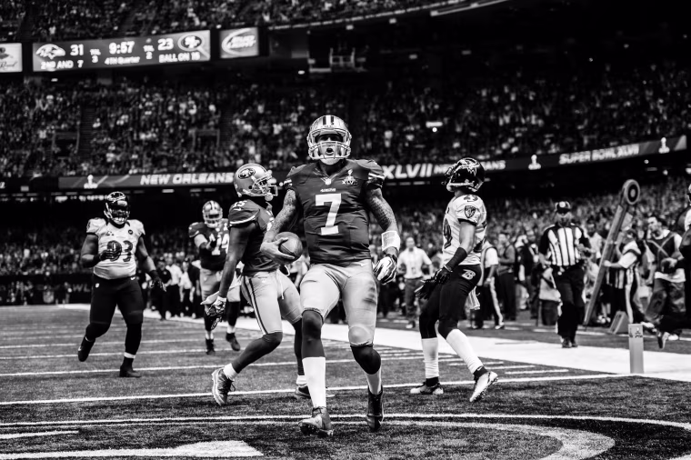 Colin Kaepernick celebrates on the field/