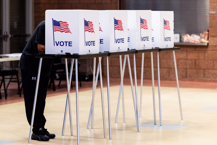 A voter casts their ballot at a polling center.