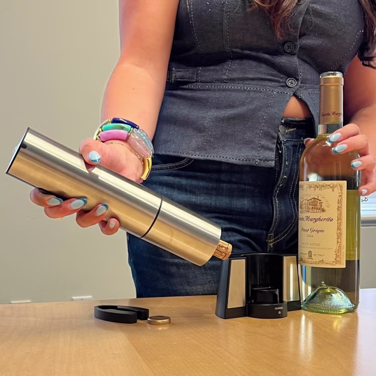 The Cuisinart wine opener ejects the fully-removed cork with the press of a button.