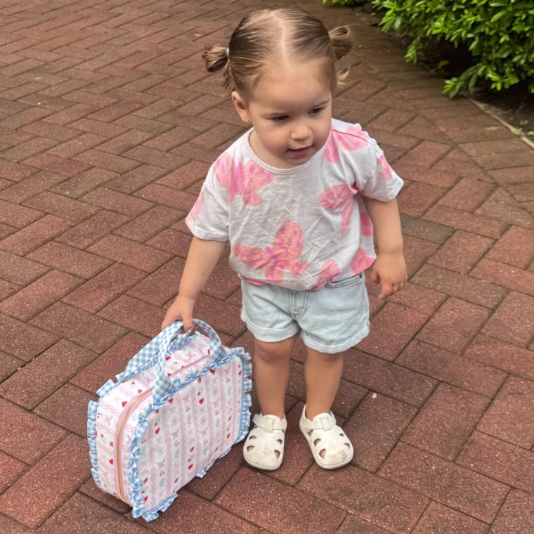 The Meri Meri x Stoney Clover Lane lunch tote has a structured, reinforced base that hasn't collapsed even when it's not completely full.