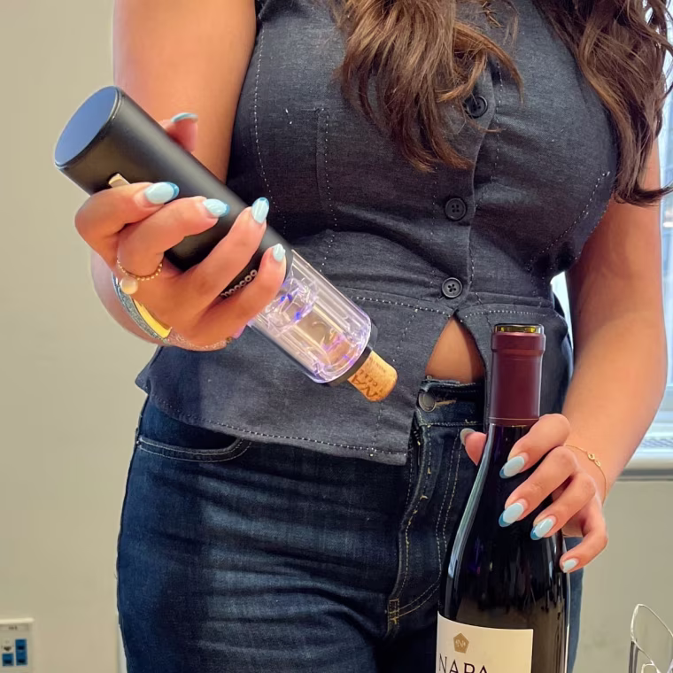 The Moocoo wine electric wine opener has a clear bottom and ejects the cork with the press of a button. 