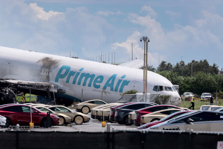 Investigators continue work Monday to determine what caused the crash of an Amazon cargo plane at Miami International Airport.Joe Raedle / Getty Images
