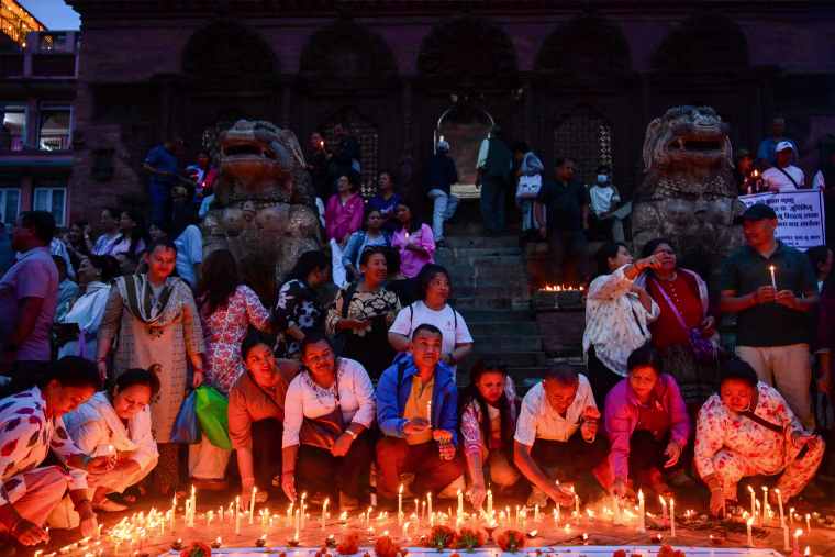 People light candles at Basantapur Durbar Square in Kathmandu, Nepal, on September 7, 2026, to honor those who lost their lives in the Bhote Koshi River floods and landslides in Rasuwa and other affected areas, as Nepal observes a national day of mourning declared by the government of Nepal.