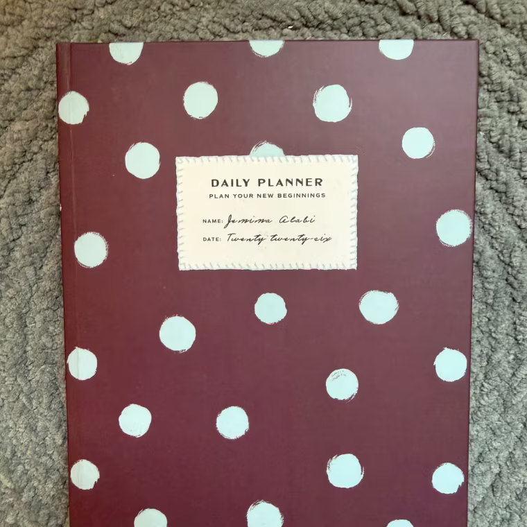 Papier Dotted & Spotted Undated Daily Planner closed on a table.