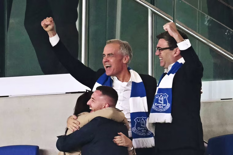 ritain's Prime Minister Andy Burnham, right, and Canada's Prime Minister Mark Carney celebrate Everton's first goal 