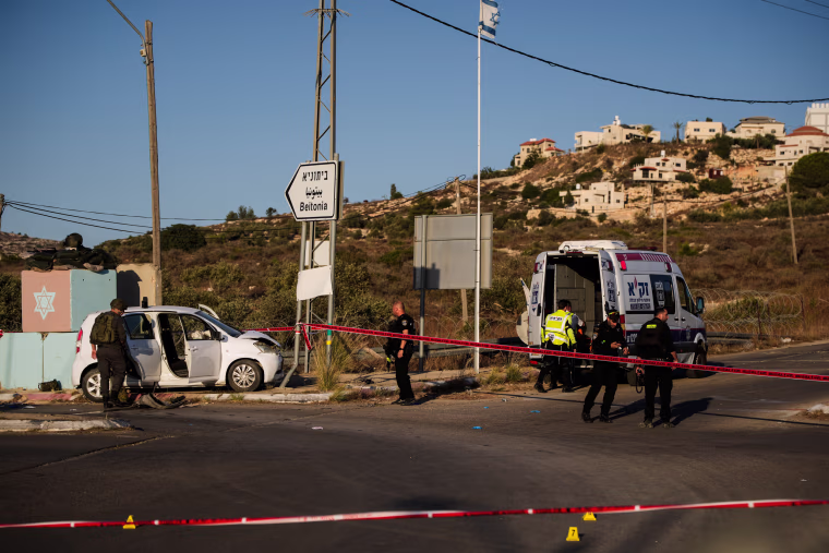 Israeli security forces inspect the scene.