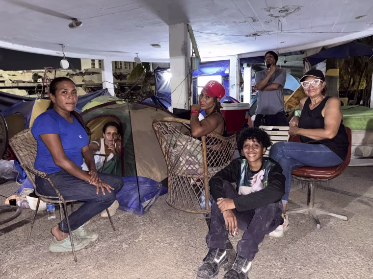 Living in a camp at the Residencias Caribe in La Guaira, where one of three towers collapsed completely.
