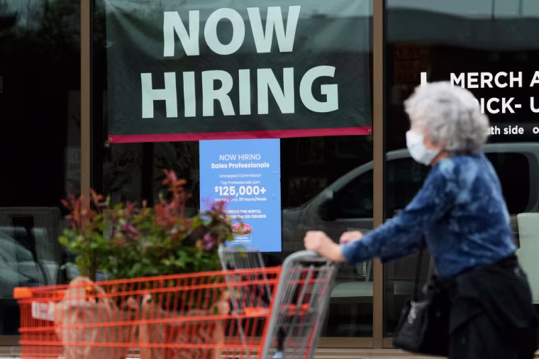 ARCHIVE — A notice seeking sales specialists at a store in Vernon Hills, Illinois. Nam Y. Huh / AP Photo/Nam Y. Huh