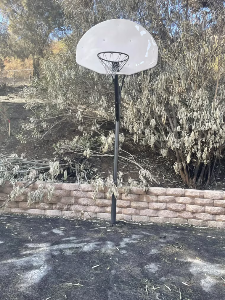 After the fire, the basketball hoop remained standing.