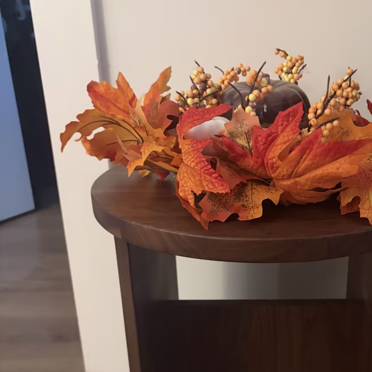 Dark wood stool on wood flooring