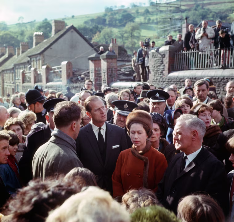 Queen Elizabeth II visits the coal mining village of Aberfan in Wales, following the disaster which resulted in the deaths of 116 children and 28 adults, on Oct. 29, 1966.