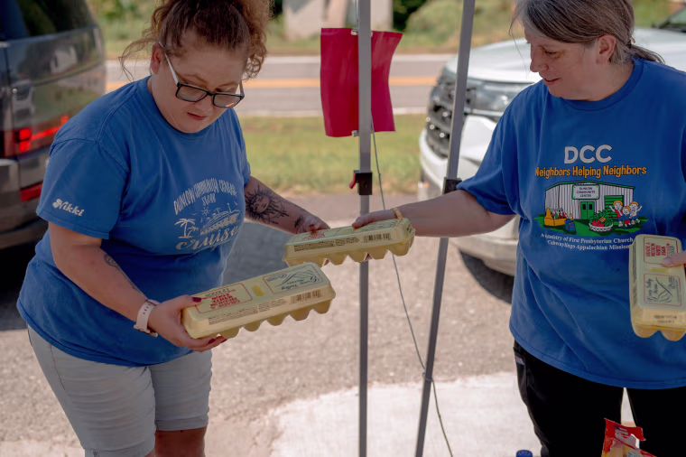 Staff members and volunteers gave each car two cartons of eggs at the food distribution in Dunlow.