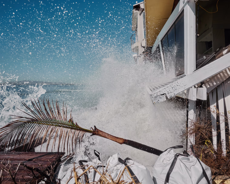 Waves crash into 6527 Seaside Walk at the The Peninsula in Long Beach, Calif., on Oct. 15, 2026.