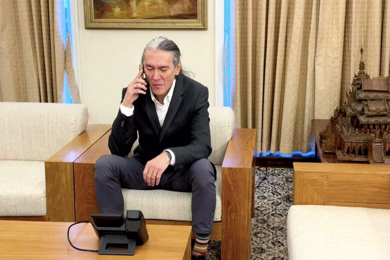 Image: Kim Aris on the phone