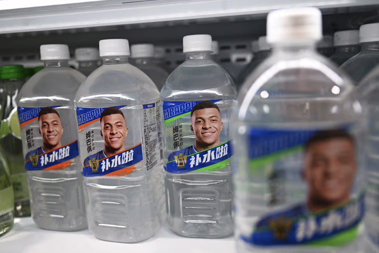 Image: Kylian Mbappe's face on Dongpeng electrolyte drink bottles.