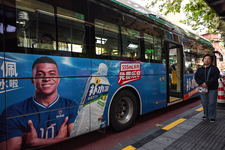 Image: Mbappe's face on a bus in Shanghai, as part of a Dongpeng advertisement.