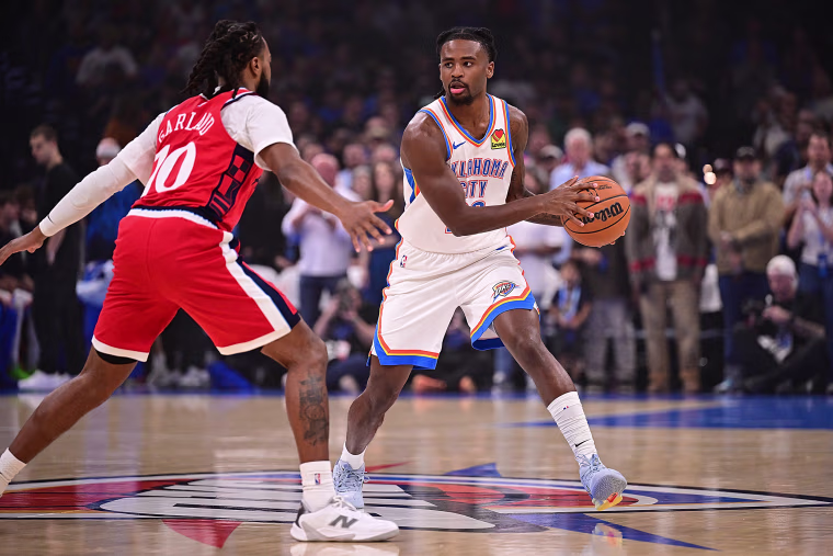  Cason Wallace of the Oklahoma City Thunder handles the ball in front of Darius Garland of the LA Clippers