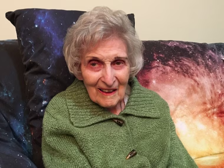 Gloria honors her curiosity about outer space by reading.