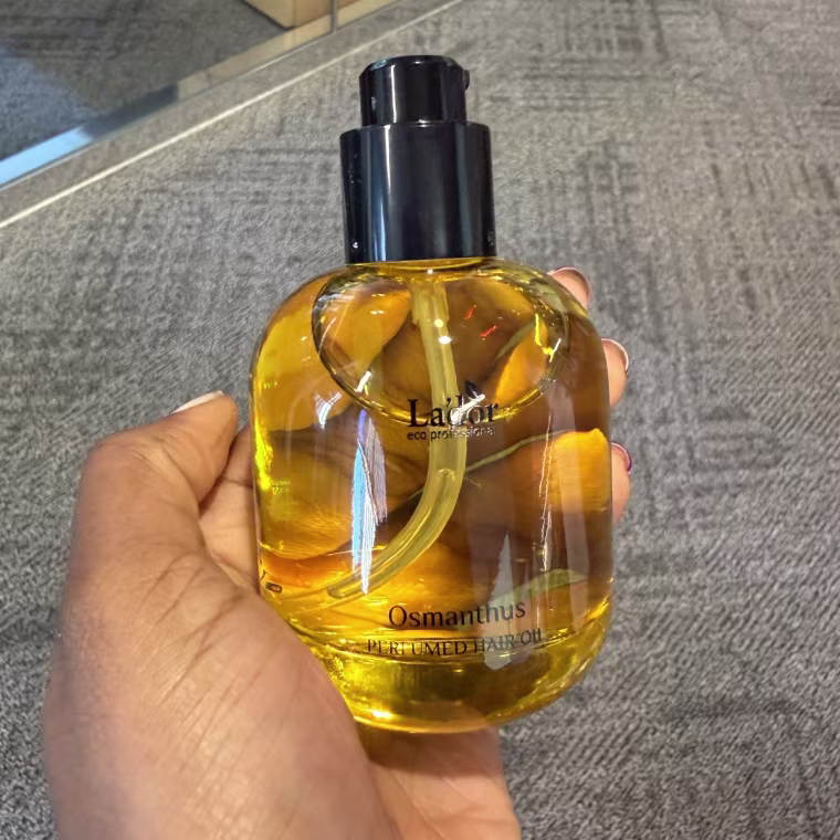 Close up shot of glass hair oil bottle.