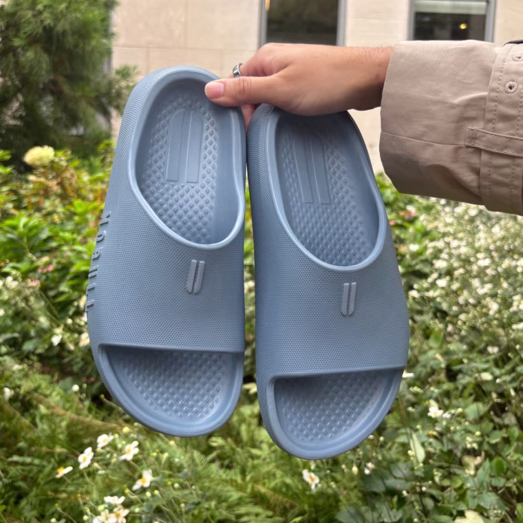 A person wearing Nobull’s Recharge Slide.
