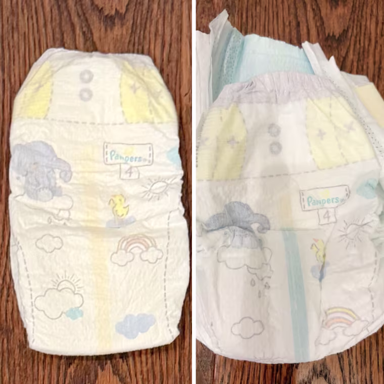 Side-by-side photos of a Pampers Swaddlers size 4 diaper with an elephant, duck and rainbow print, showing a yellow wetness line on the left and a blue line on the right.
