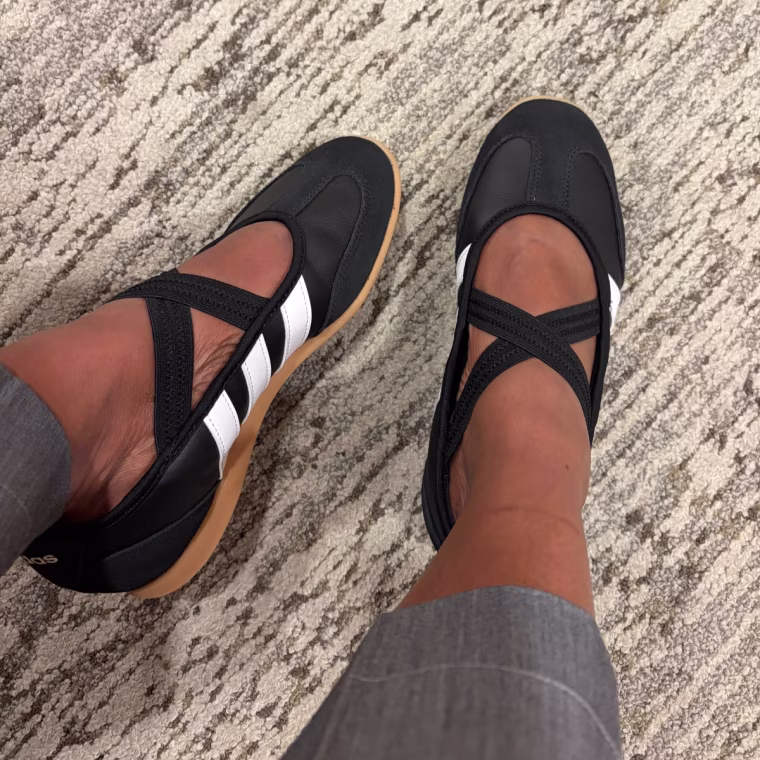 A person’s feet in Adidas Barreda Mary Jane sneakers