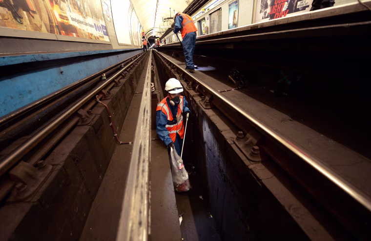 Cleaners, known as fluffers, work in Highbury and Islington station in London March 30, 2012.