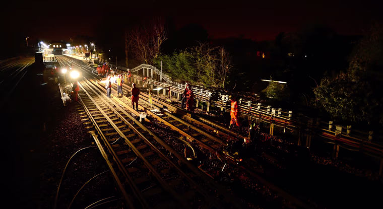 Maintenance workers repair part of the tracks at Northwood Hills tube station on the Metropolitan Line in London March 29, 2012.