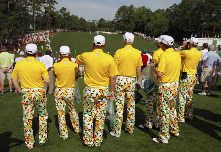 A group of spectators in matching golf attire watch first round play in the 2012 Masters Golf Tournament at the Augusta National Golf Club in Augusta, Ga. on April 5.