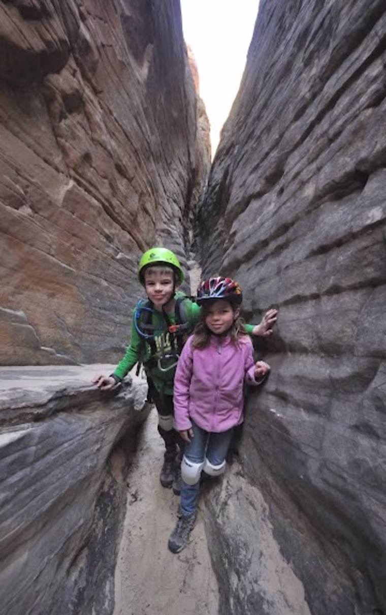 Nate and Alex in a narrow slot canyon at Capitol Reef National Park in Utah.