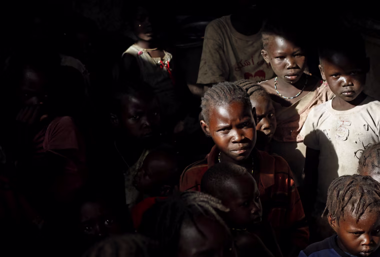 Children sits in a cave shelter in Bram village in the Nuba Mountains, South Kordofan, Sudan.
