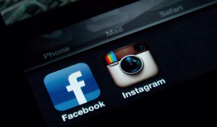 A photo illustration shows the applications Facebook and Instagram on the screen of an iPhone in Zagreb on April 9 when Facebook announced it will acquire the photo-sharing application Instagram.