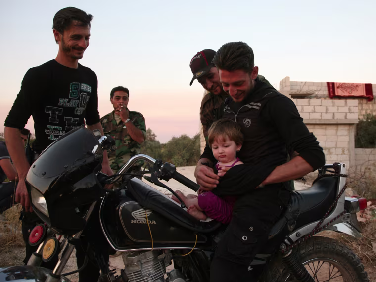 Machine guns operated by motorcycle brakes? Get a glimpse at the rebels fighting against Assad's forces in Syria's mountainous Jabal al-Zawiya area.