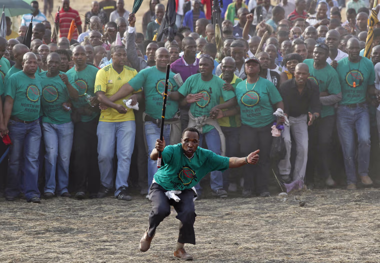 Miners during a memorial service for miners killed during clashes last week.