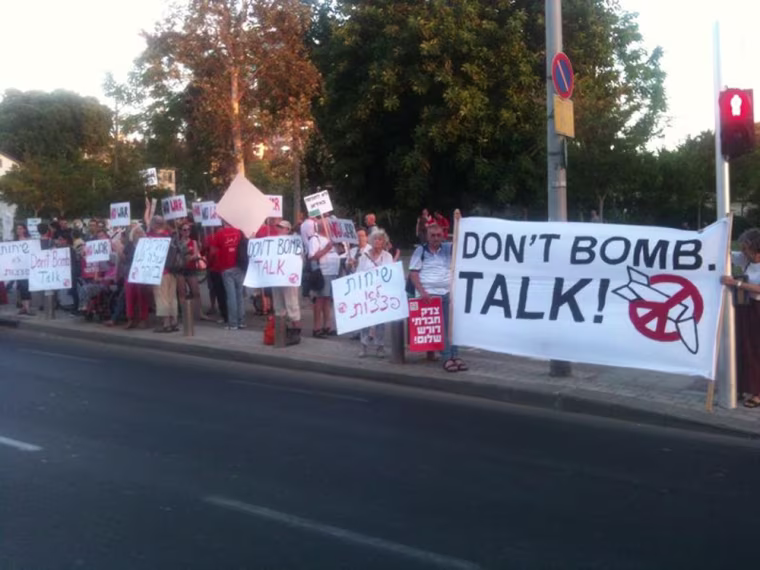 Around 100 people demonstrated against a war with Iran in Tel Aviv on Thursday.