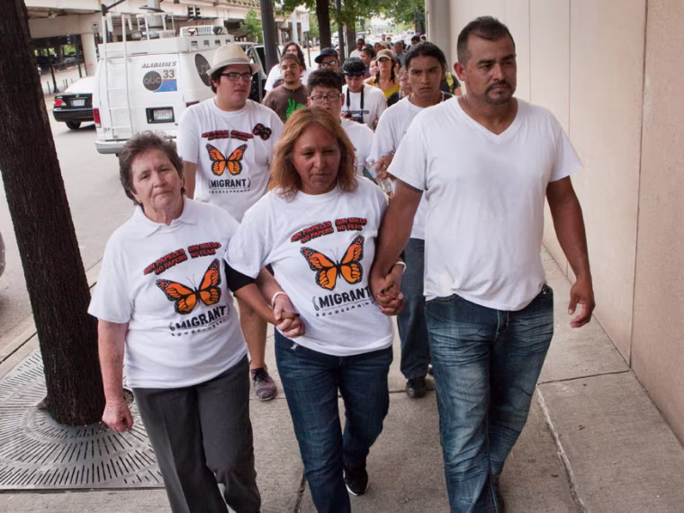Maria Huerta, Maria Cruz Ramirez and Gerardo Torres, who are all undocumented, enter a civil rights hearing on the impact of state immigration laws held in Birmingham, Ala., on Aug. 17, 2012.