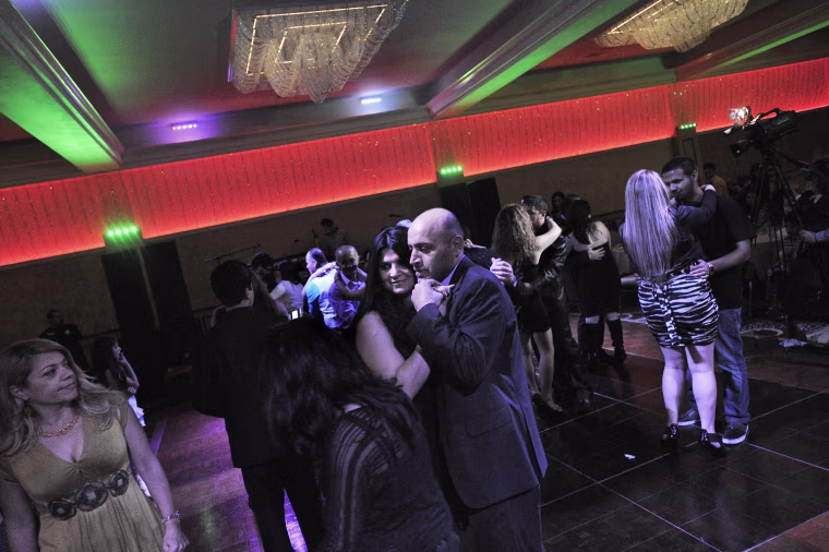 Samad and Dina Jabbo dance at a banquet organized for the Iraqi community in El Cajon, Calif. Samad, 40, his wife Dina, 37, and their daughters Monica, 16, and Milano, 12, and son Antonio, 7 months, arrived in the United States in June 2010 after living in Damascus, Syria, for four years. They are Christians from Baghdad and have green cards. They felt their lives were in danger when they lived in Iraq.