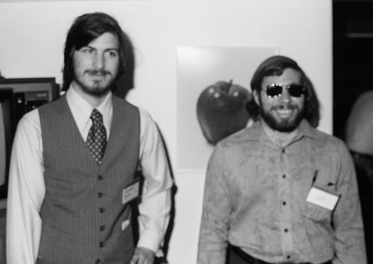 Portrait of American businessmen and engineers Steve Jobs (left) and Steve Wozniak, co-founders of Apple Computer Inc, at the first West Coast Computer Faire, where the Apple II computer was debuted, in Brooks Hall, San Francisco, California, April 16th or 17th, 1977. (Photo by Tom Munnecke/Getty Images)