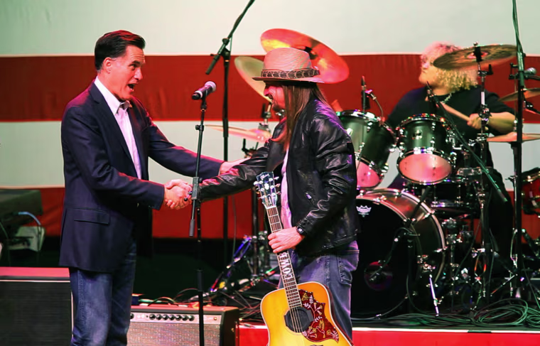 Monday, February 27, 2012, in Royal Oak, MI (John Makely / msnbc.com) Mitt Romney thanks Kid Rock he and his band performed at the rally supporting Romney's campaign for President. The marquis sign of the Royal Oak theater in Royal Oak, Michigan announces the invitation only rally for Mitt Romney on the eve of the Republican primary election in his home state of Michigan.