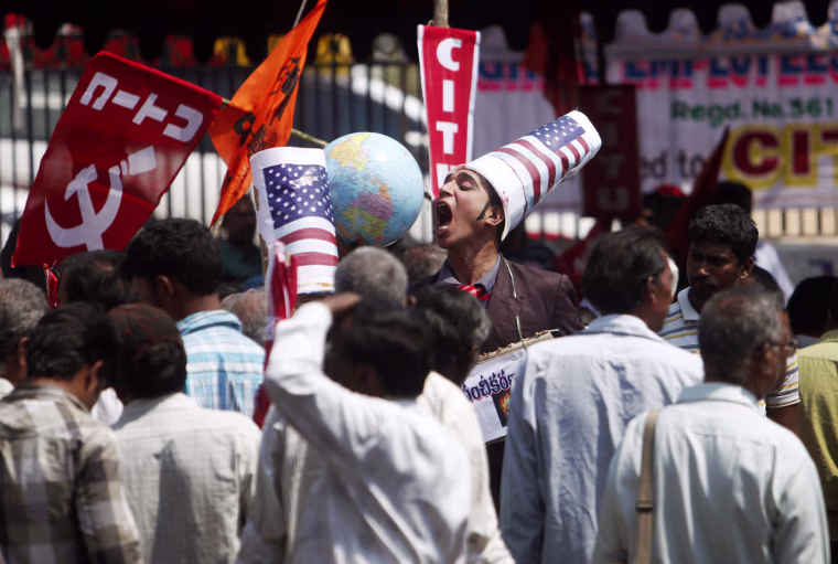 An Indian supporter of left wing party participates in a protest in support of a one-day general strike in Hyderabad, India, Tuesday, Feb. 28, 2012. Shops and banks were closed, factories shuttered and traffic sparse in major cities across India during an industrial strike Tuesday called by trade unions against the government. Eleven major trade unions called for the strike to protest against rampant inflation. (AP Photo/Mahesh Kumar A.)