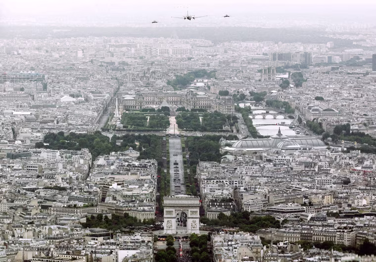 French military aircraft fly over Paris during the Bastille Day military parade in Paris, on July 14.