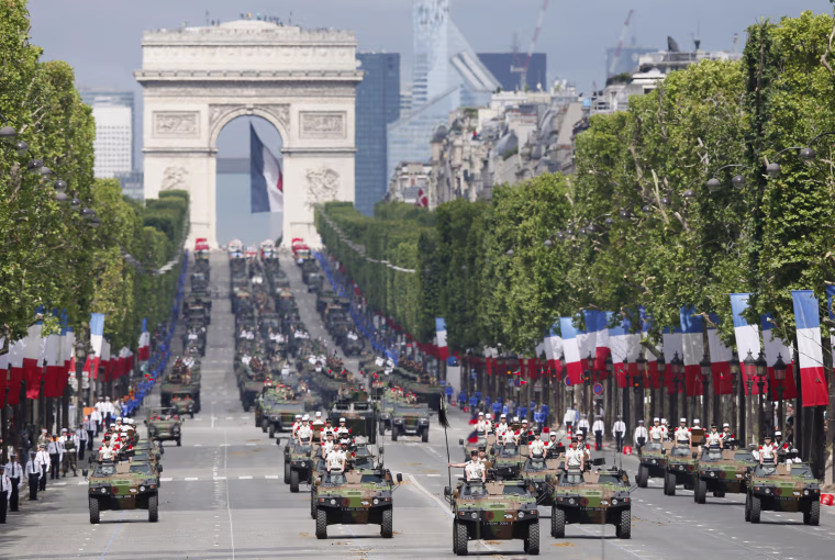 Armored vehicles parade down the Champs Elysees as part of the Bastille Day Military parade in Paris, France, on July 14. The Bastille Day, the French National Day, is held annually on 14 July to commemorate the storming of the Bastille fortress in 1789.