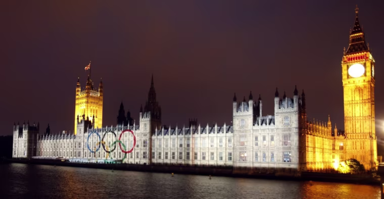 The Olympic rings are projected on the Palace of Westminster and the Big Ben on the bank of the River Thames, July 27.